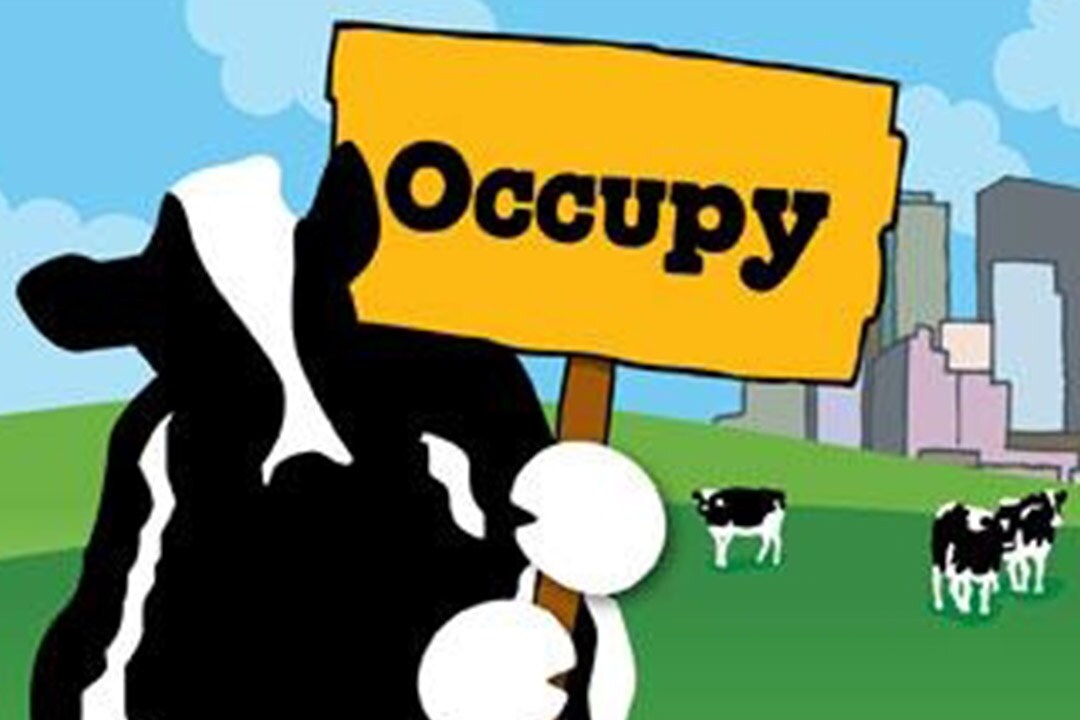 Woodie tiene un cartello che recita “Occupy!”